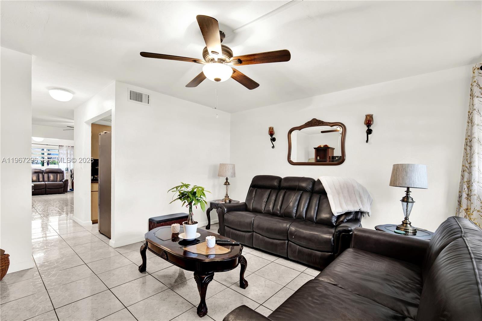 10881 Southwest 6th Street, Unit 7 Sweetwater, FL 33174 - Photo 5 of 34 a living room with furniture