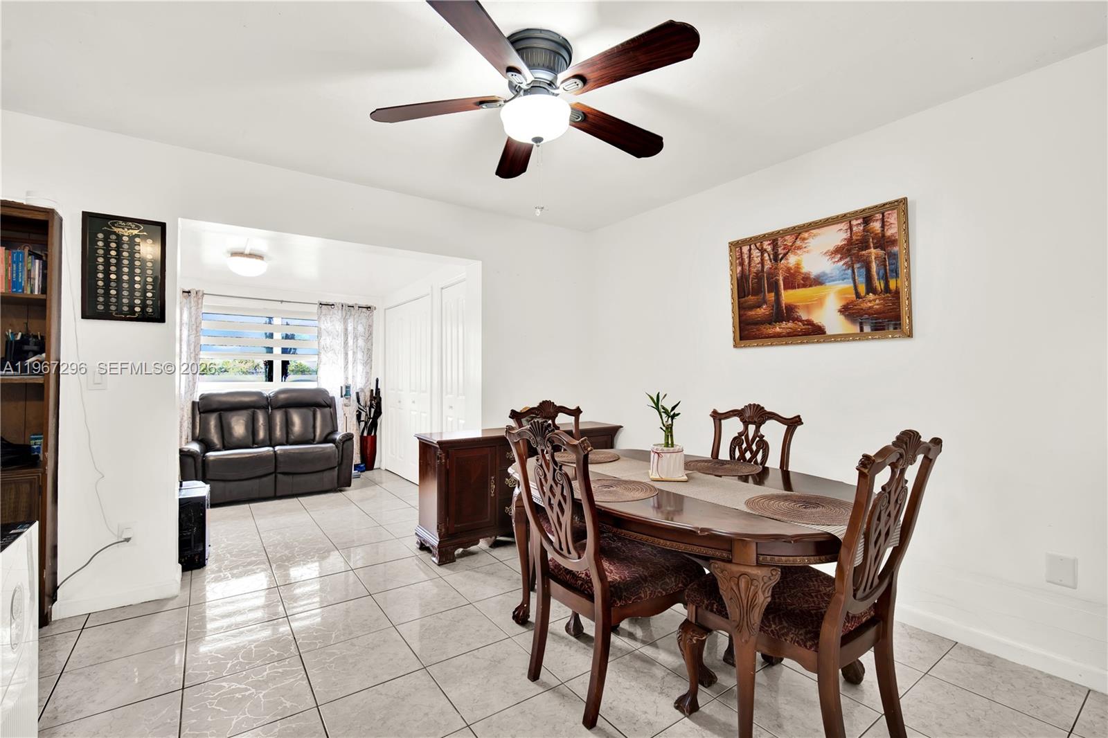 10881 Southwest 6th Street, Unit 7 Sweetwater, FL 33174 - Photo 8 of 34 a view of a dining room with furniture