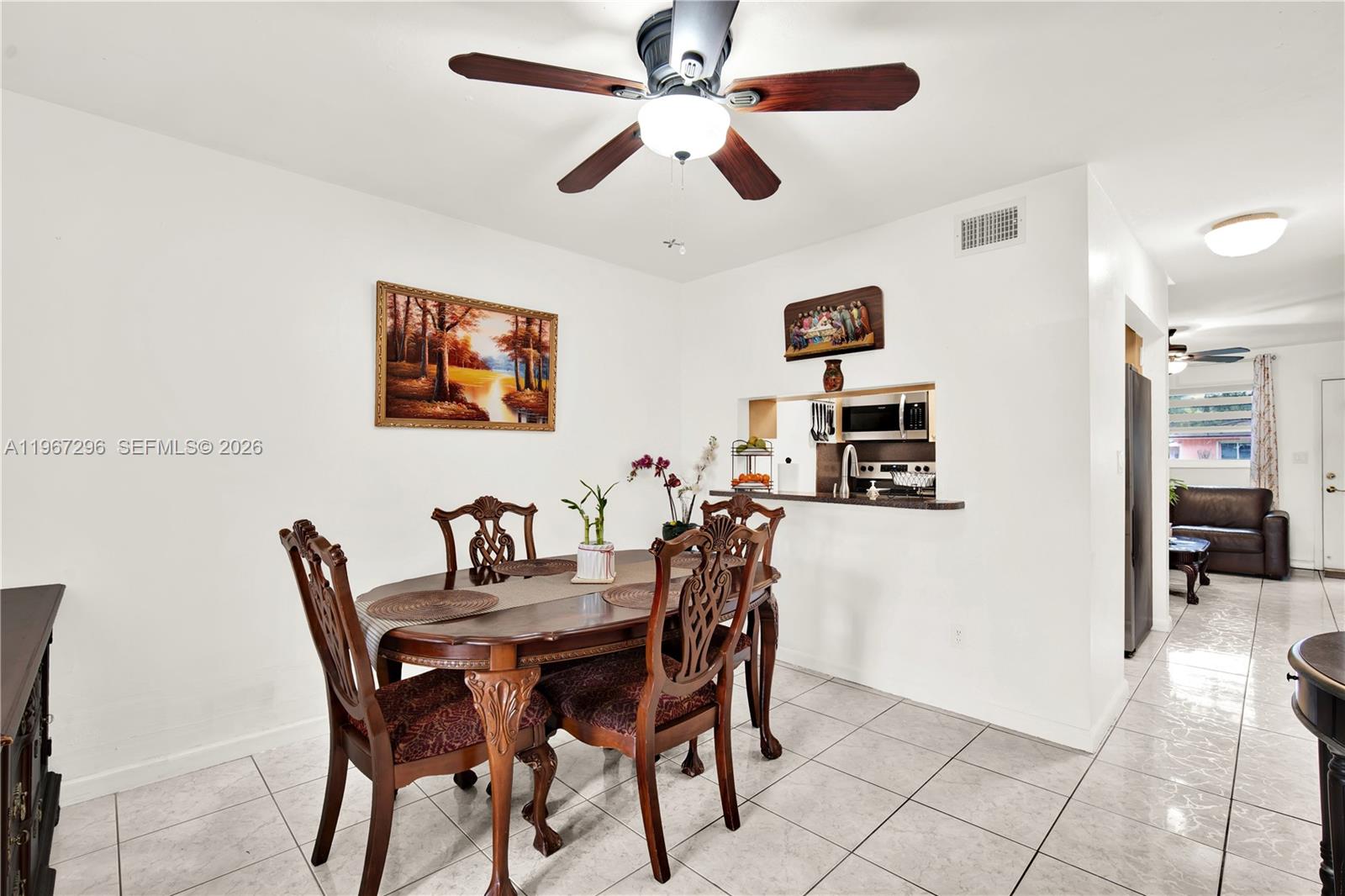 10881 Southwest 6th Street, Unit 7 Sweetwater, FL 33174 - Photo 9 of 34 a view of a dining room with furniture