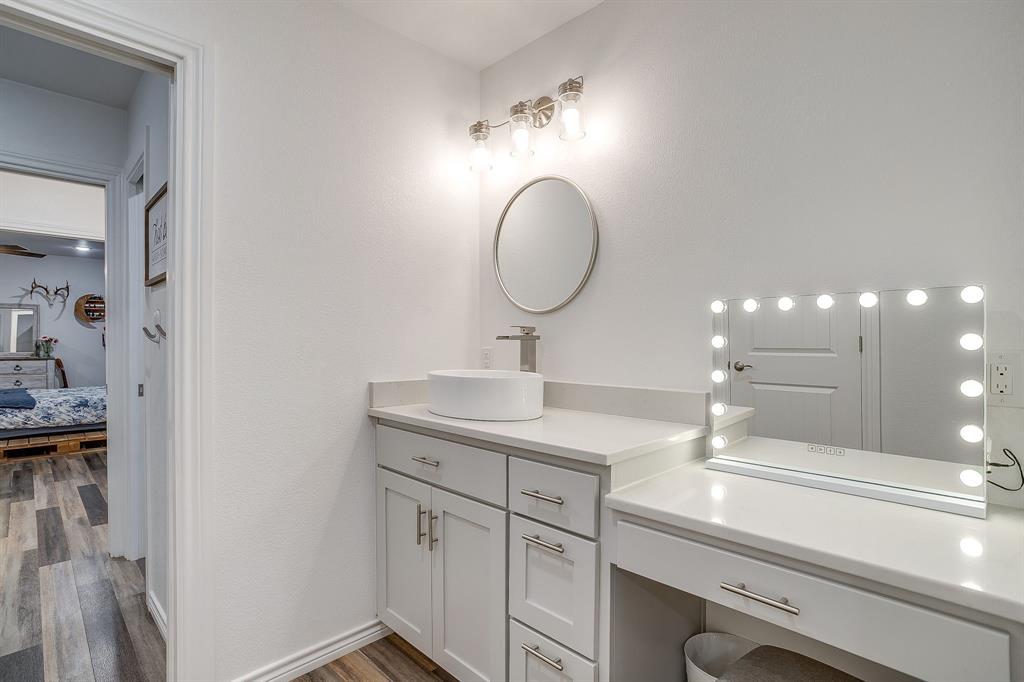 733 Fm 2652 Graham, TX 76450 - Photo 19 of 40 a bathroom with a sink and a mirror