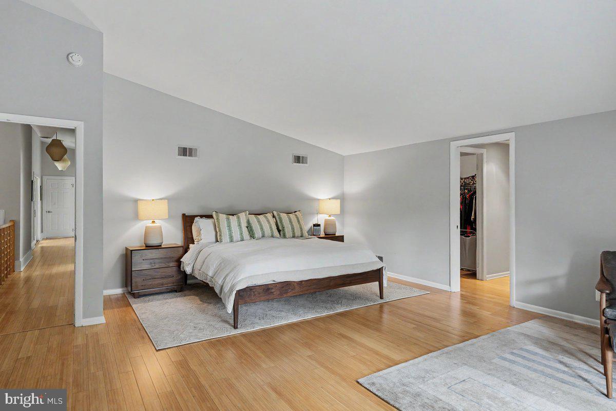 13 High Road New Hope, PA 18938 - Photo 25 of 56 a spacious bedroom with a bed and wooden floor