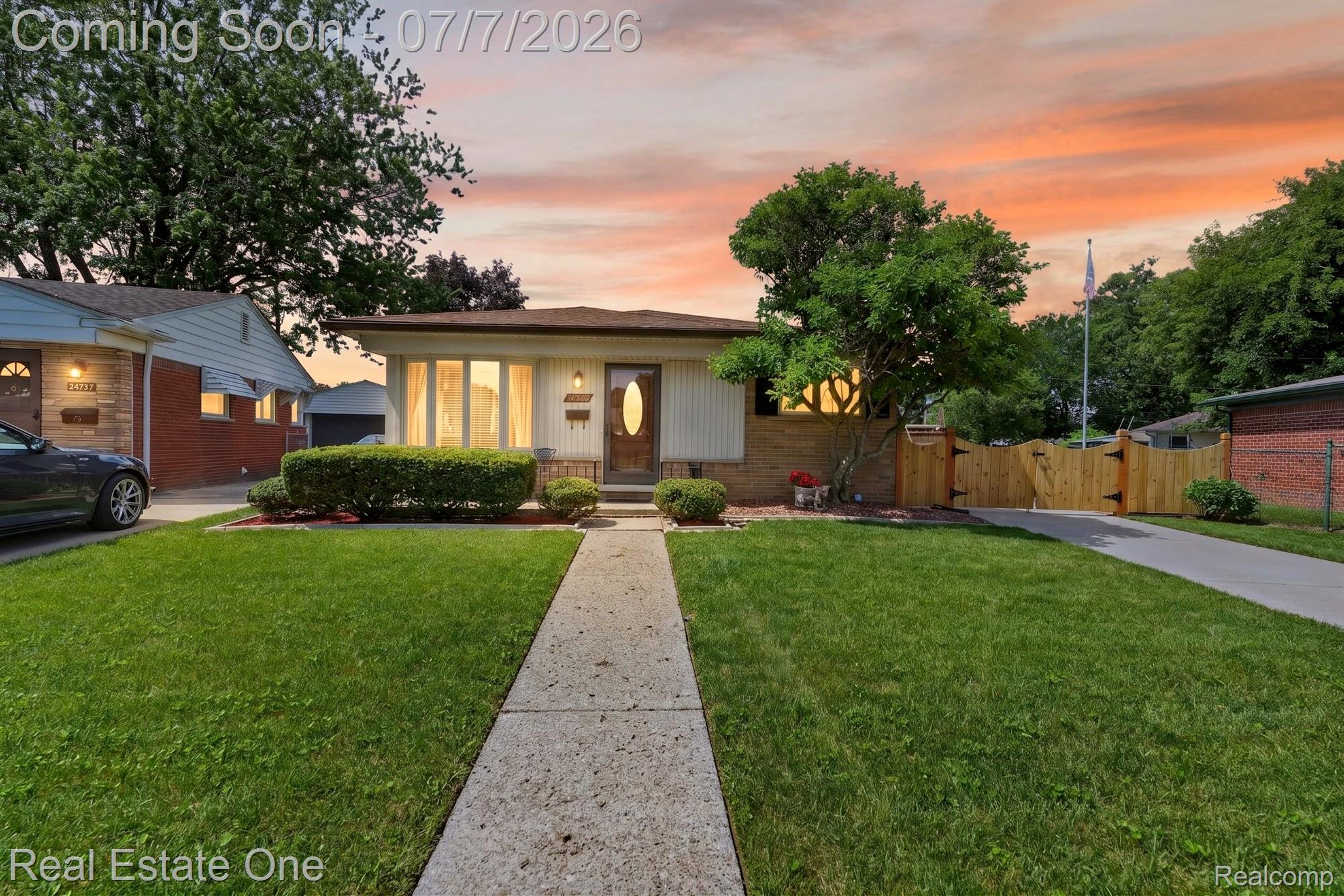 24749 Munson Street Taylor, MI 48180 - Photo 1 of 28 Ranch-style exterior with a manicured front lawn, established landscaping, and a concrete walkway