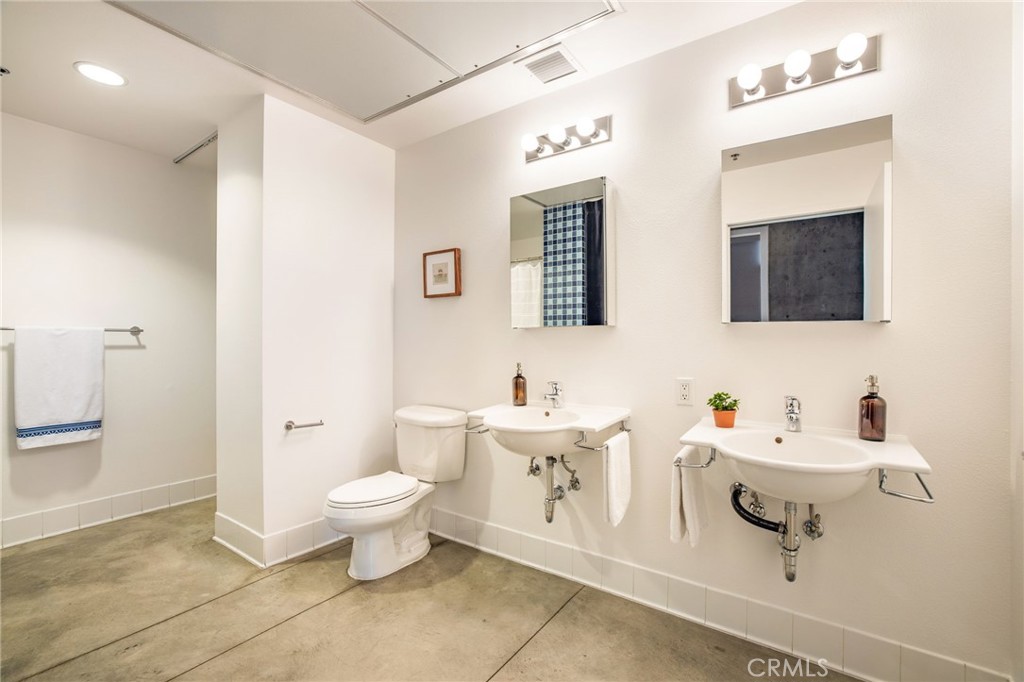 835 Locust Avenue, Unit 519 Long Beach, CA 90813 - Photo 20 of 42 a bathroom with a sink toilet and shower
