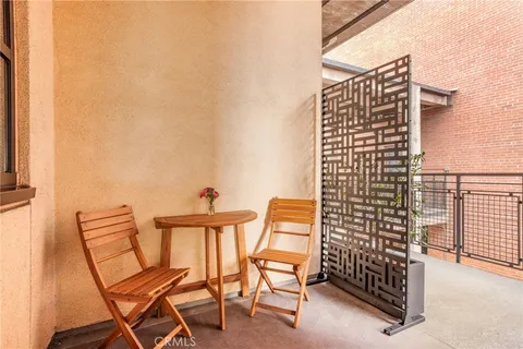 a view of balcony with chairs