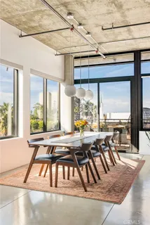 a view of a dining room with furniture window and outside view
