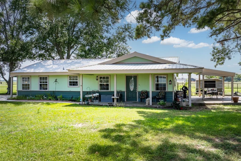 113 L B J Ranch Road Trinidad, TX 75163 - Photo 1 of 11 View of front of house featuring covered porch, a front yard, and a metal roof