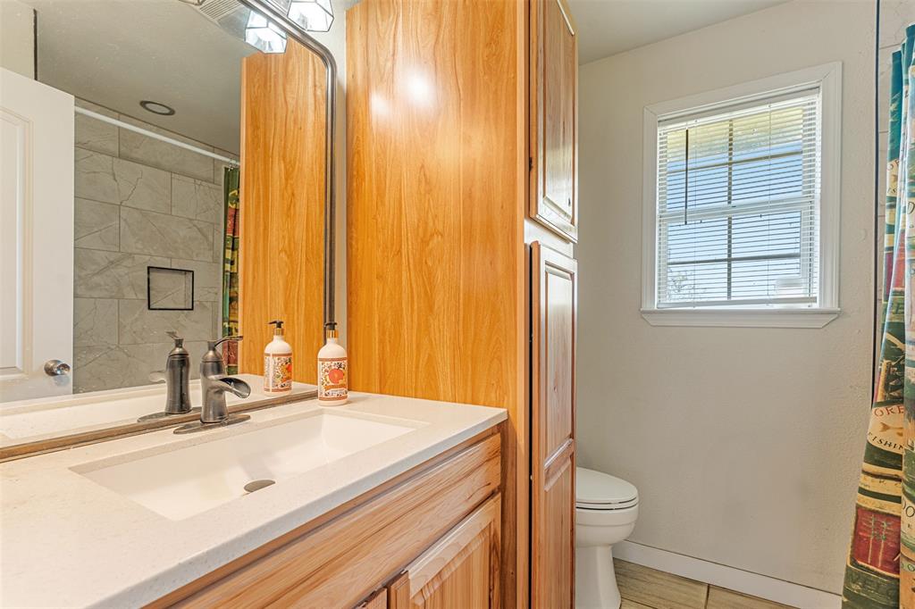 113 L B J Ranch Road Trinidad, TX 75163 - Photo 7 of 11 Full bathroom featuring vanity and a shower with shower curtain