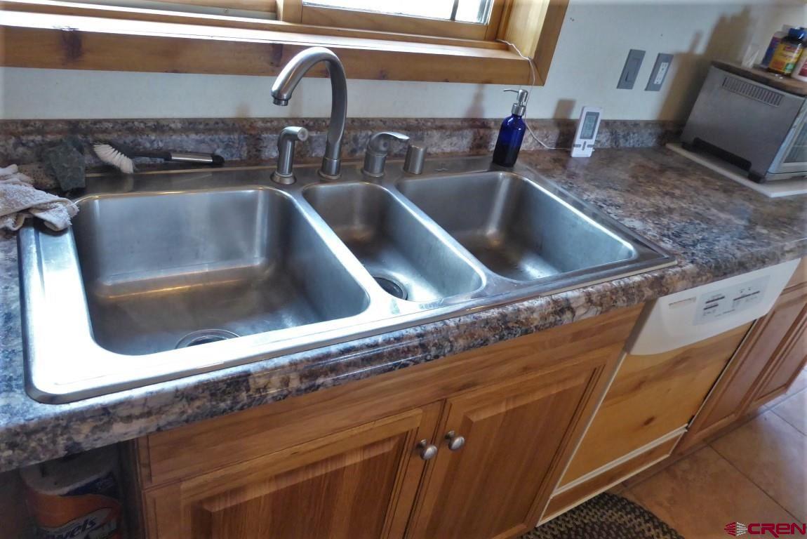 19850 2325th Road Cedaredge, CO 81413 - Photo 12 of 35 a close view of sink and tap