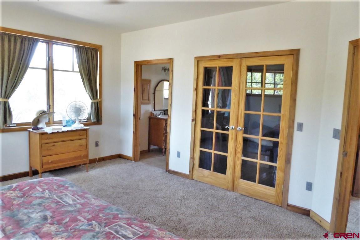 19850 2325th Road Cedaredge, CO 81413 - Photo 17 of 35 a view of an empty room with a window