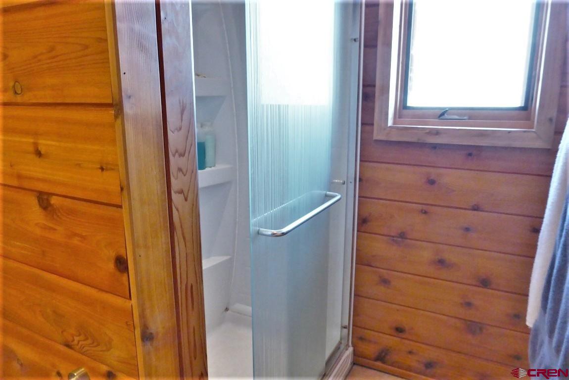 19850 2325th Road Cedaredge, CO 81413 - Photo 25 of 35 a bathroom with a shower