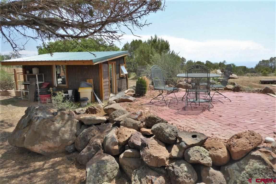 19850 2325th Road Cedaredge, CO 81413 - Photo 30 of 35 a view of a chairs and table in a patio