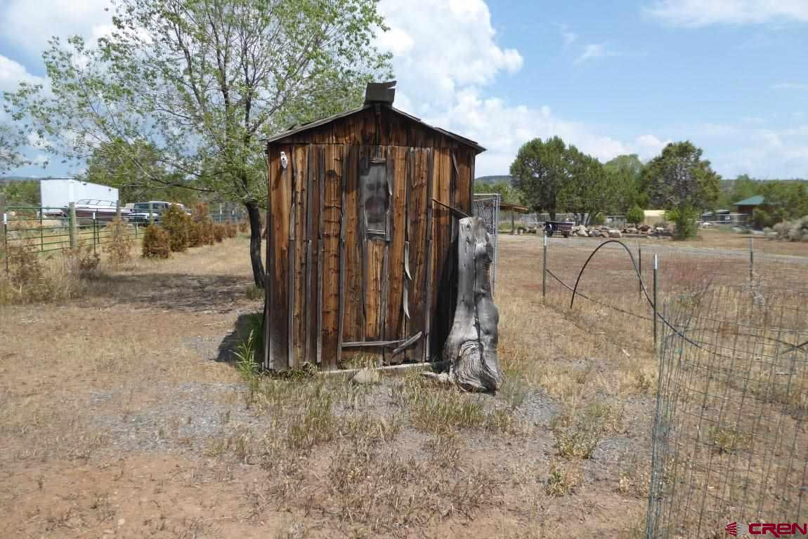 19850 2325th Road Cedaredge, CO 81413 - Photo 32 of 35 a view of a wooden fence with an outdoor space