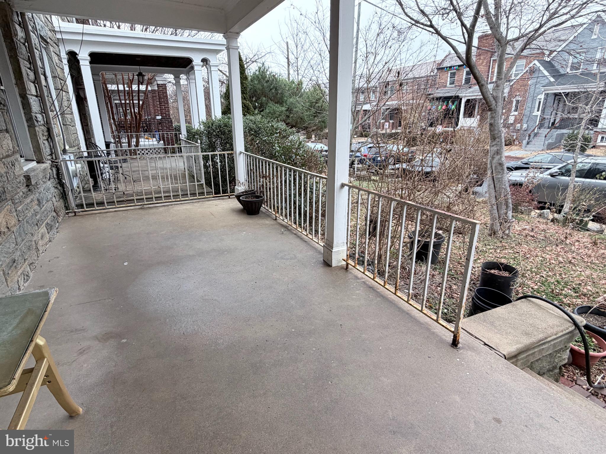 1328 Rittenhouse Street Northwest Washington, DC 20011 - Photo 4 of 10 a view of a porch with furniture and floor to ceiling window