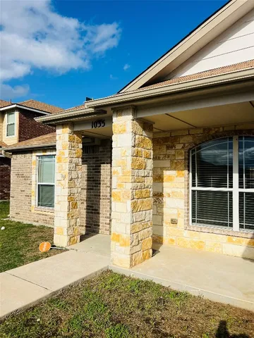 a front view of a house with a garage