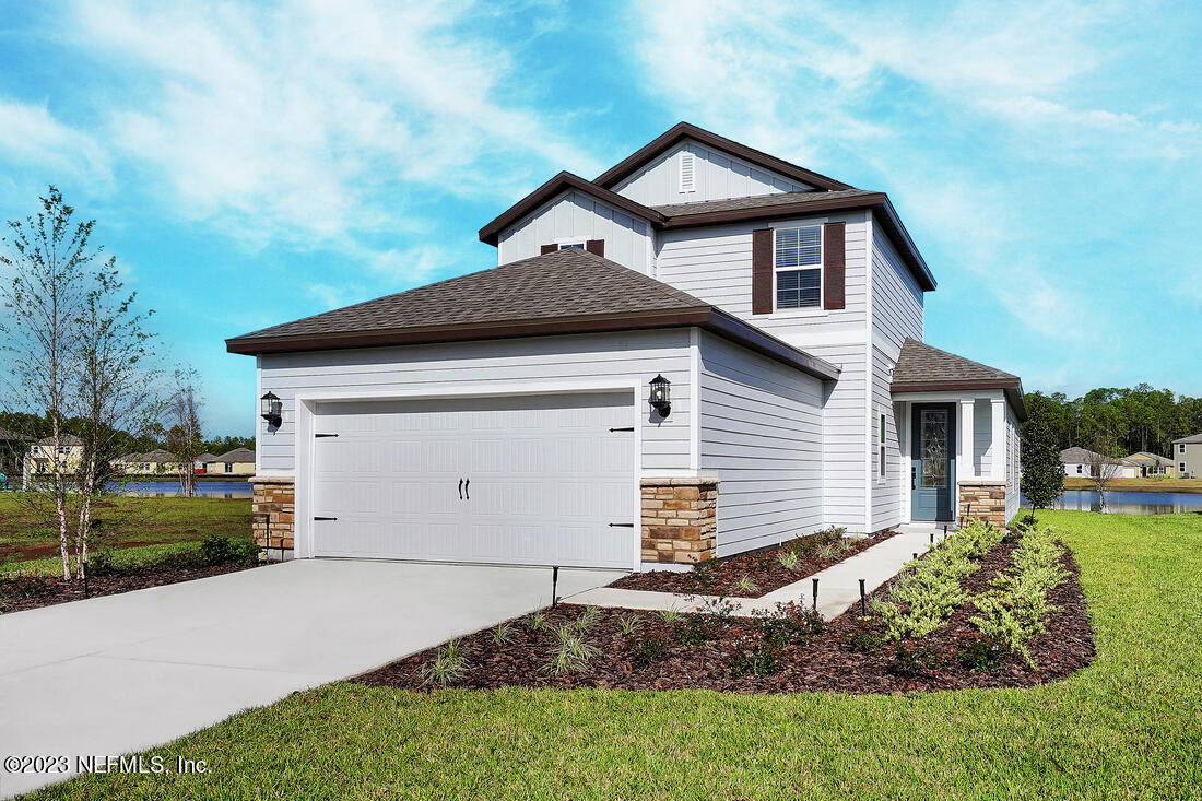1084 Morgans Treasure Road St. Augustine, FL 32084 - Photo 1 of 11 a front view of a house with a yard