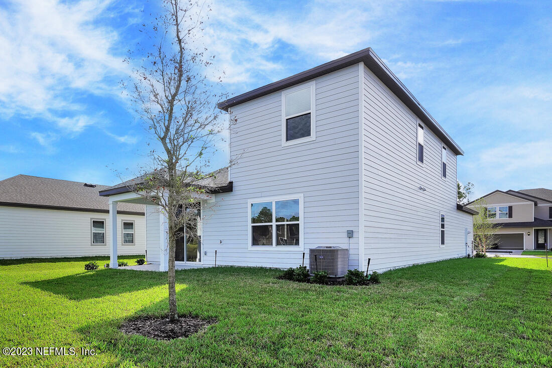 1084 Morgans Treasure Road St. Augustine, FL 32084 - Photo 11 of 11 a front view of a house with a garden