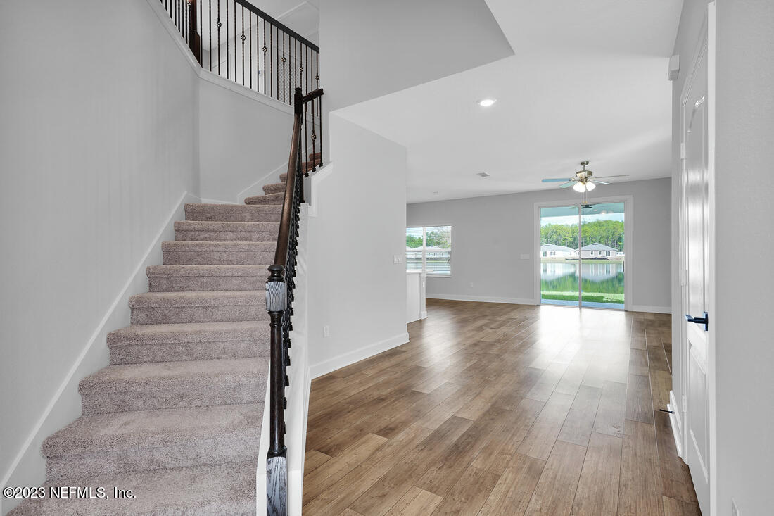 1084 Morgans Treasure Road St. Augustine, FL 32084 - Photo 6 of 11 a view of entryway and hall with wooden floor