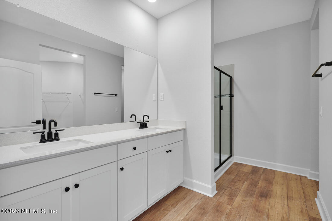 1084 Morgans Treasure Road St. Augustine, FL 32084 - Photo 9 of 11 a bathroom with a double vanity sink and mirror