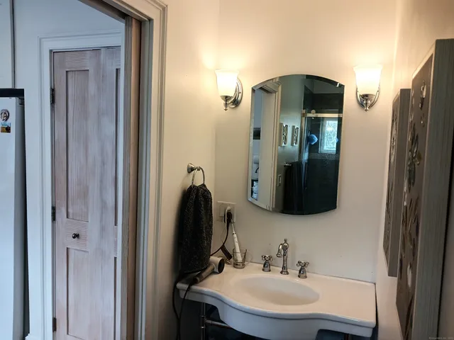 a bathroom with a sink and a mirror