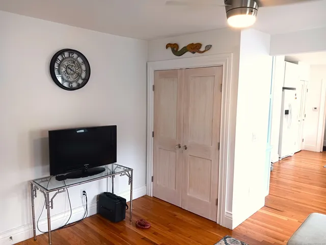 a view of a livingroom with furniture and a flat screen tv