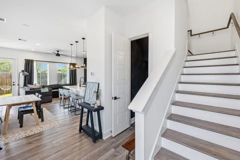 a view of entryway and hall with wooden floor
