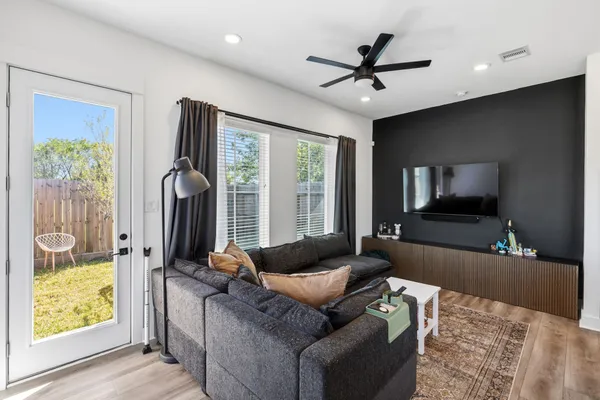 a living room with furniture and a large window