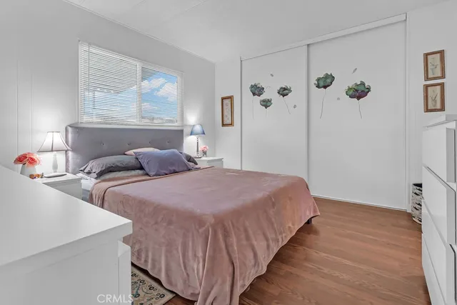 a bedroom with double bed and a window