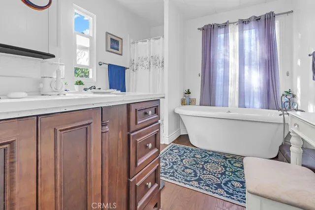 a bathroom with a bathtub and a sink