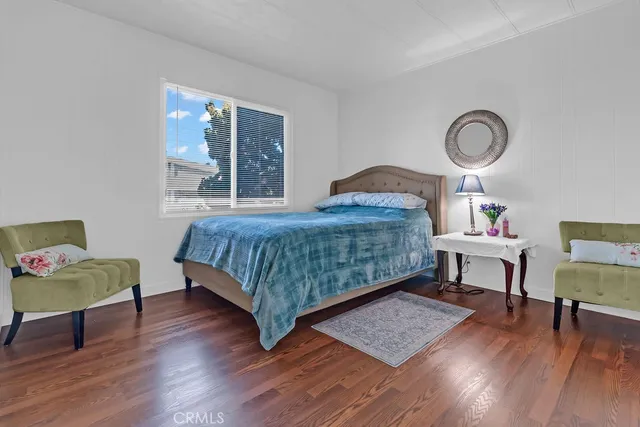 a bedroom with a bed and a table in it