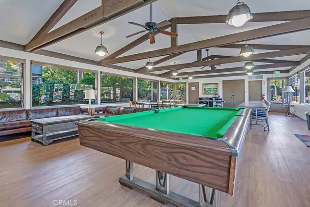 a garden view with a sitting space and garden in the background