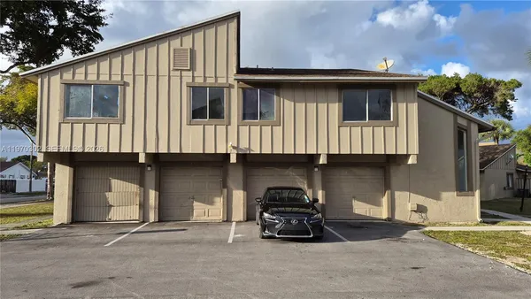 a car parked in front of a house