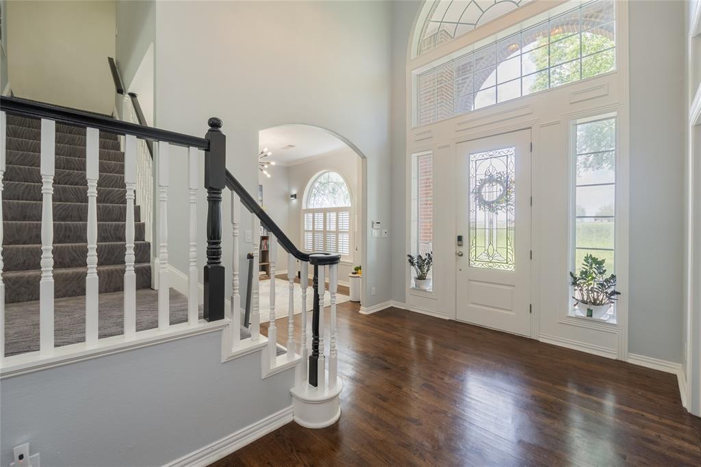 135 Kirkpatrick Road Ennis, TX 75119 - Photo 4 of 40 a view of an entryway with wooden floor door and a window