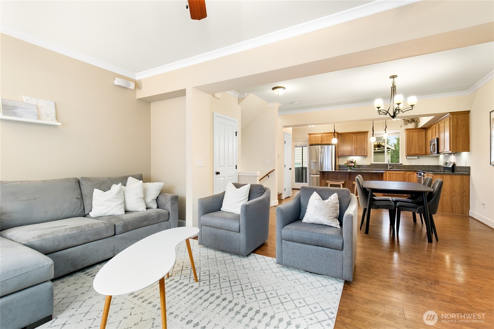 320 Chelan Place Northeast, Unit H1 Renton, WA 98059 - Photo 14 of 30 a living room with furniture and wooden floor