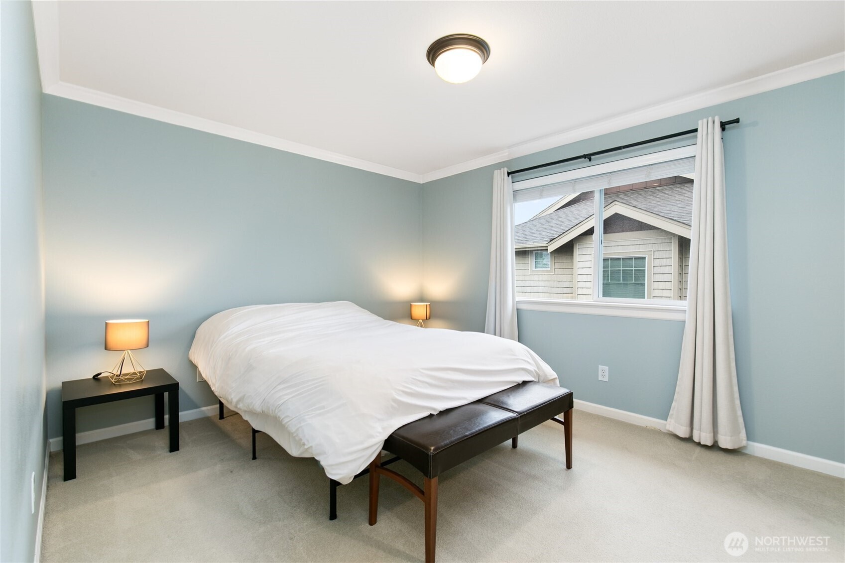 320 Chelan Place Northeast, Unit H1 Renton, WA 98059 - Photo 17 of 30 a bedroom with a bed and a table