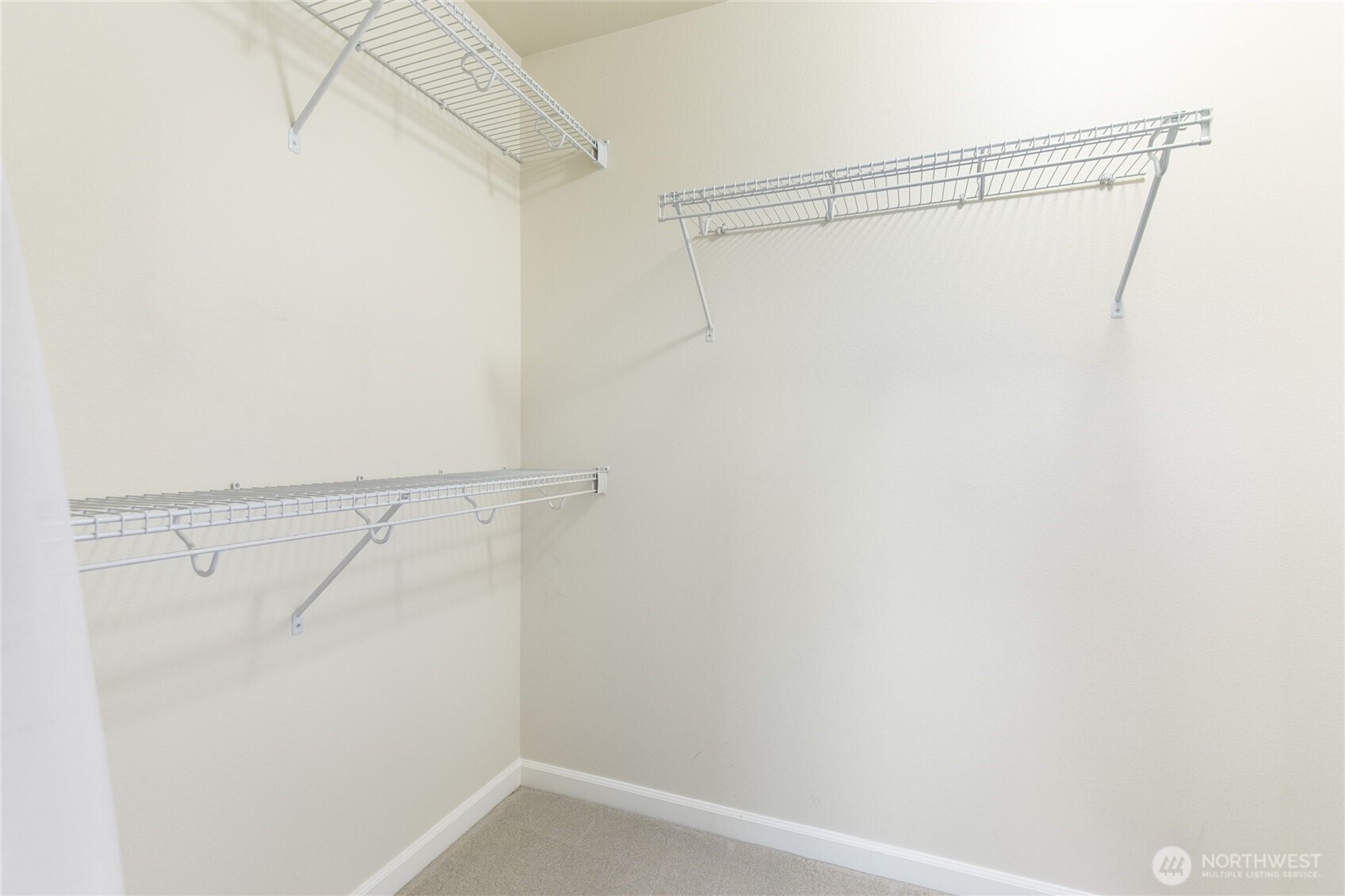 320 Chelan Place Northeast, Unit H1 Renton, WA 98059 - Photo 21 of 30 a view of a room with racks on the wall
