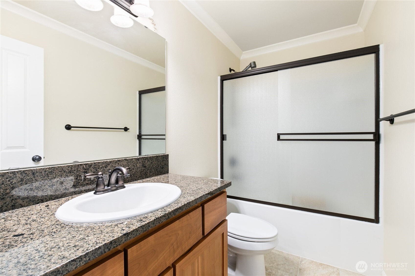 320 Chelan Place Northeast, Unit H1 Renton, WA 98059 - Photo 24 of 30 a bathroom with a granite countertop sink toilet and a mirror
