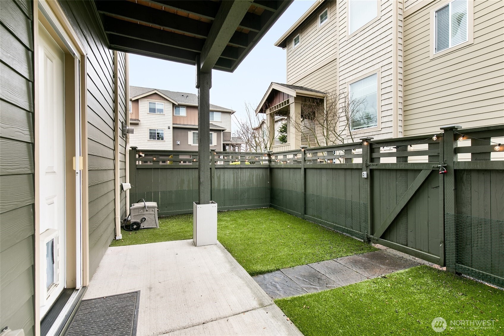 320 Chelan Place Northeast, Unit H1 Renton, WA 98059 - Photo 27 of 30 a view of a backyard with sitting area