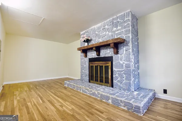 a view of a fireplace in an empty room