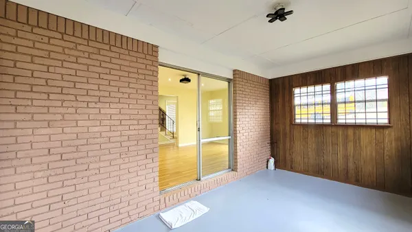 a view of an empty room with a window