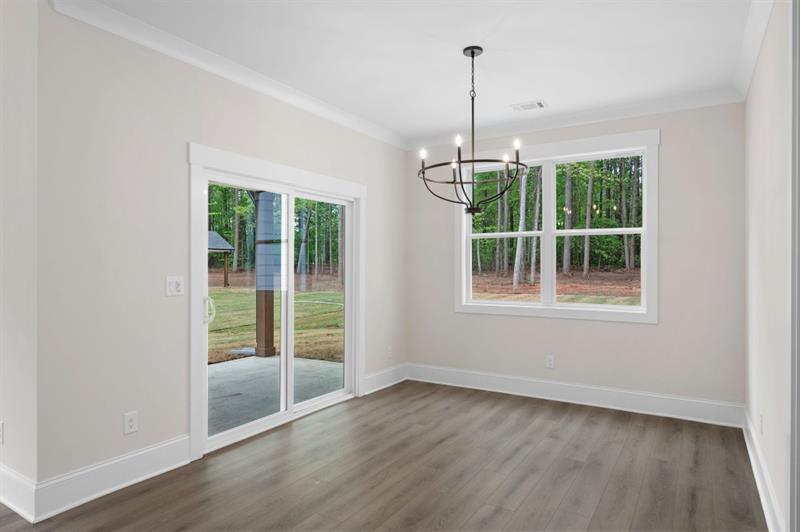 150 Doris Path Temple, GA 30179 - Photo 12 of 36 a view of an empty room with wooden floor and a window