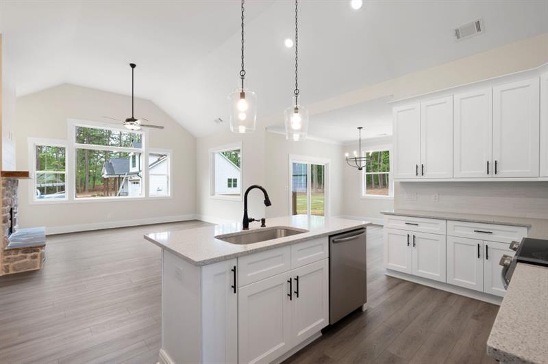 150 Doris Path Temple, GA 30179 - Photo 16 of 36 a kitchen that has a sink a window and chairs