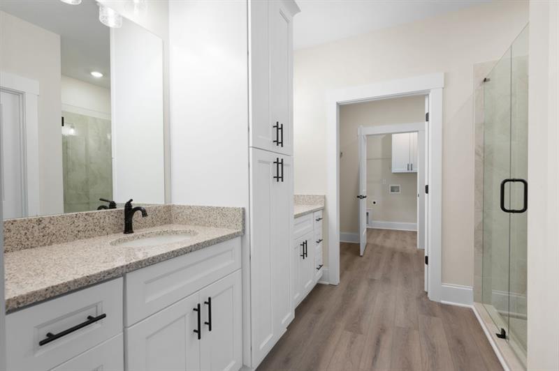150 Doris Path Temple, GA 30179 - Photo 20 of 36 a en suite bathroom with a granite countertop sink mirror and shower