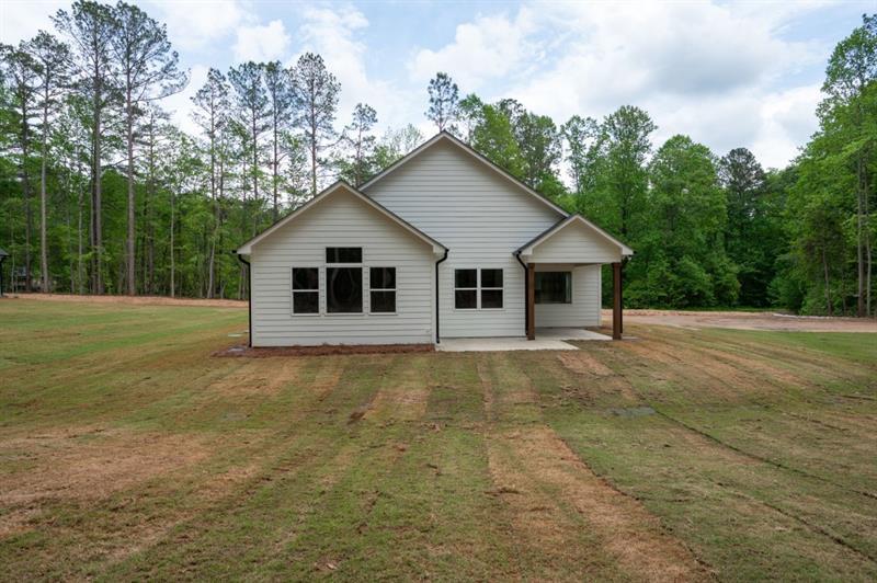 150 Doris Path Temple, GA 30179 - Photo 34 of 36 a view of a house with backyard and trees