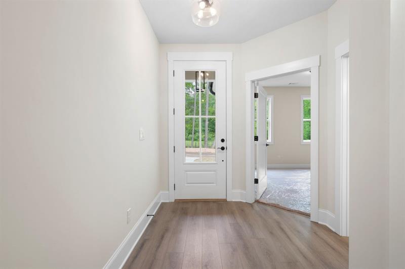 150 Doris Path Temple, GA 30179 - Photo 6 of 36 an empty room with wooden floor and windows