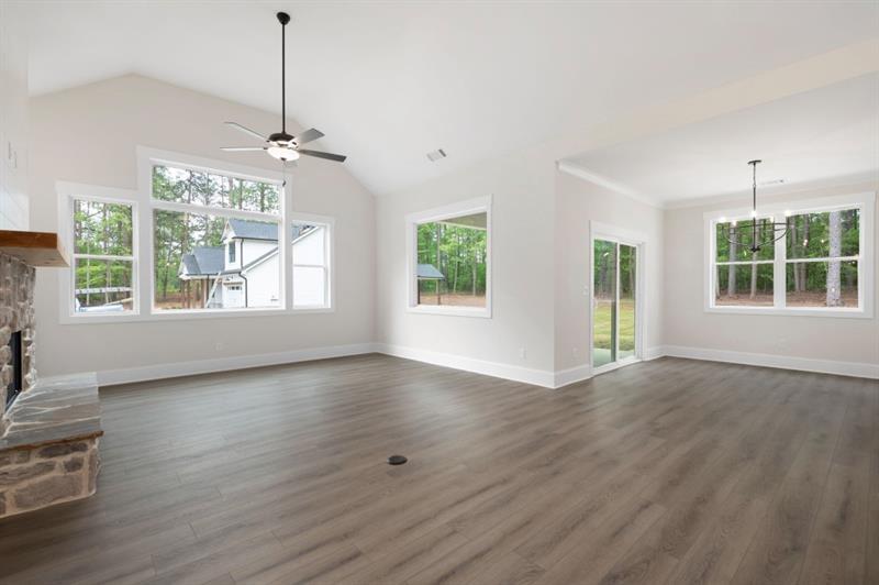 150 Doris Path Temple, GA 30179 - Photo 8 of 36 a view of an empty room with wooden floor and a window