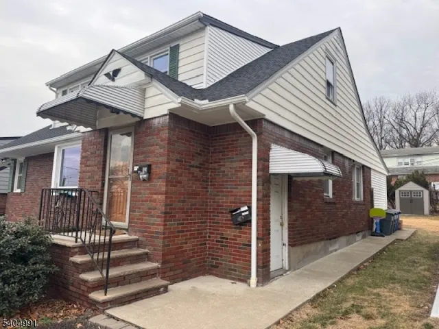a front view of a house with stairs