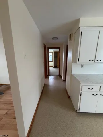 a view of a hallway with windows