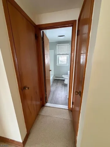 an entryway door with a mirror