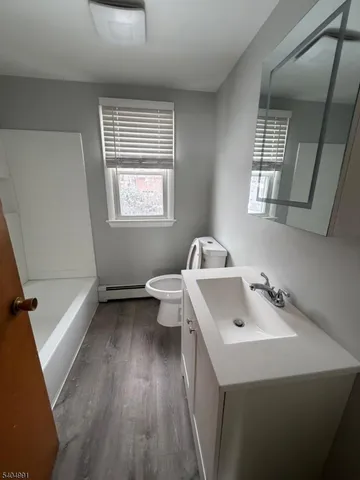 a bathroom with a sink and a bathtub