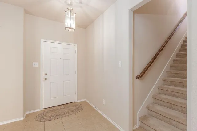 a view of entryway with stairs